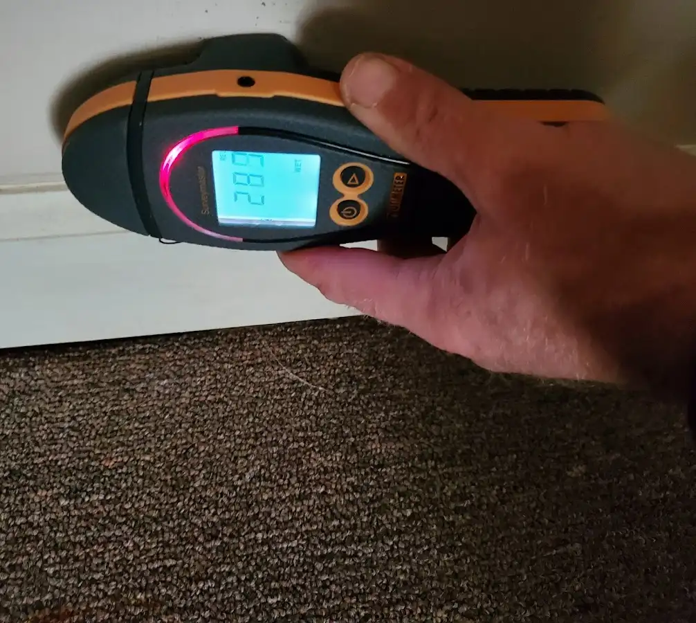 Moisture detection at baseboard during Storm Damage Restoration in McMinnville